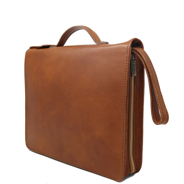 The Floto Venezia Laptop Case is a leather portfolio that is structured and has a brass zipper closure.  It can hold a small size laptop and it is handcrafted in Italy with natural full grain leather. This is the Venezia Laptop Case in Tobacco Brown. 3